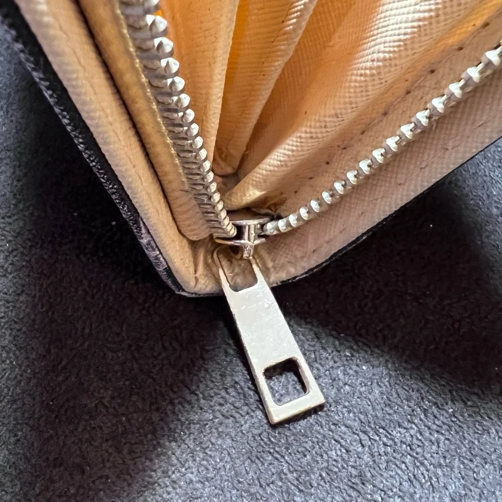 Simply southern wallet. Lots of slots for card and zips shut. Has some wear